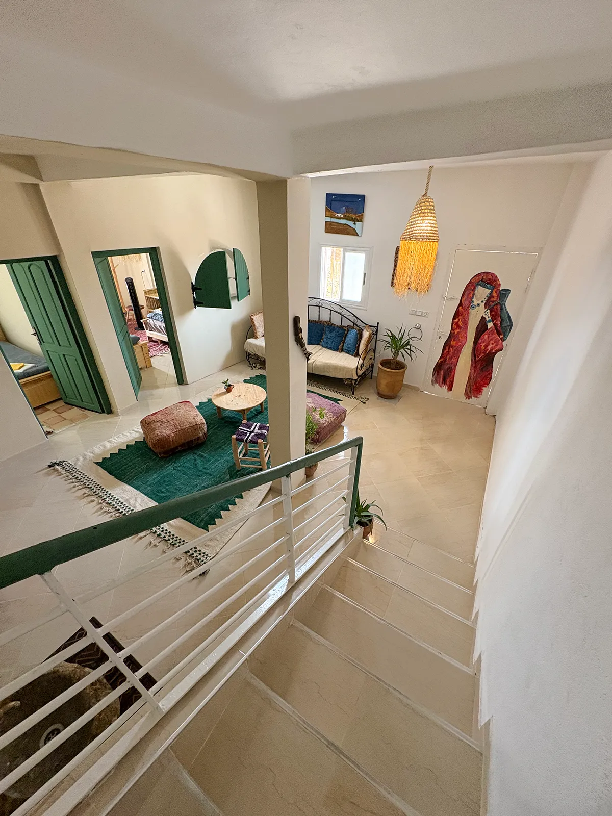 Cozy living room at Taghazout Surf Villa with sea view and communal space for surf retreat guests in Morocco