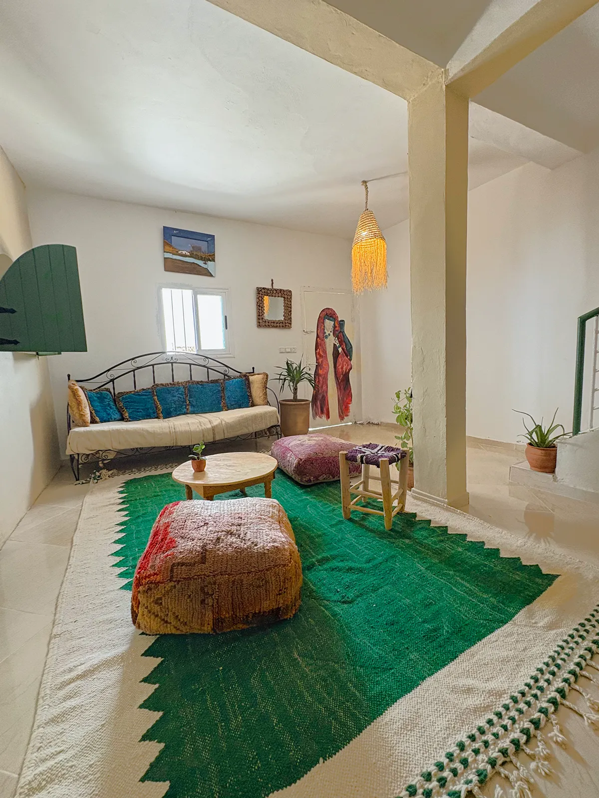 Cozy living room at Taghazout Surf Villa with sea view and communal space for surf retreat guests in Morocco