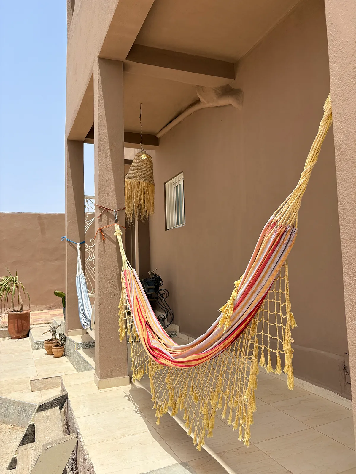 Hammock outside Taghazout Surf Villa for guest relaxation during all-inclusive Moroccan surf retreat