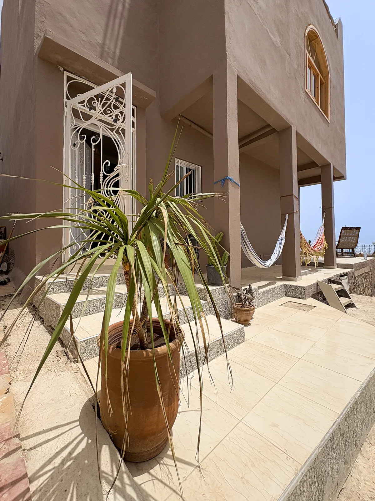 Hammock outside Taghazout Surf Villa for guest relaxation during all-inclusive Moroccan surf retreat