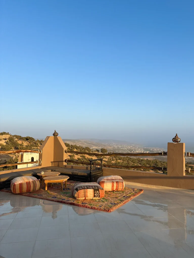 Rooftop terrace with scenic mountain view. Surf camp Morocco.