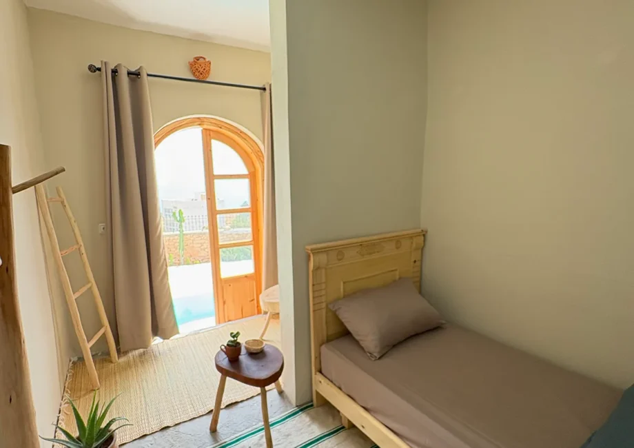 Private room at Taghazout Surf Villa with sea view and direct pool access for all-inclusive Moroccan surf stay