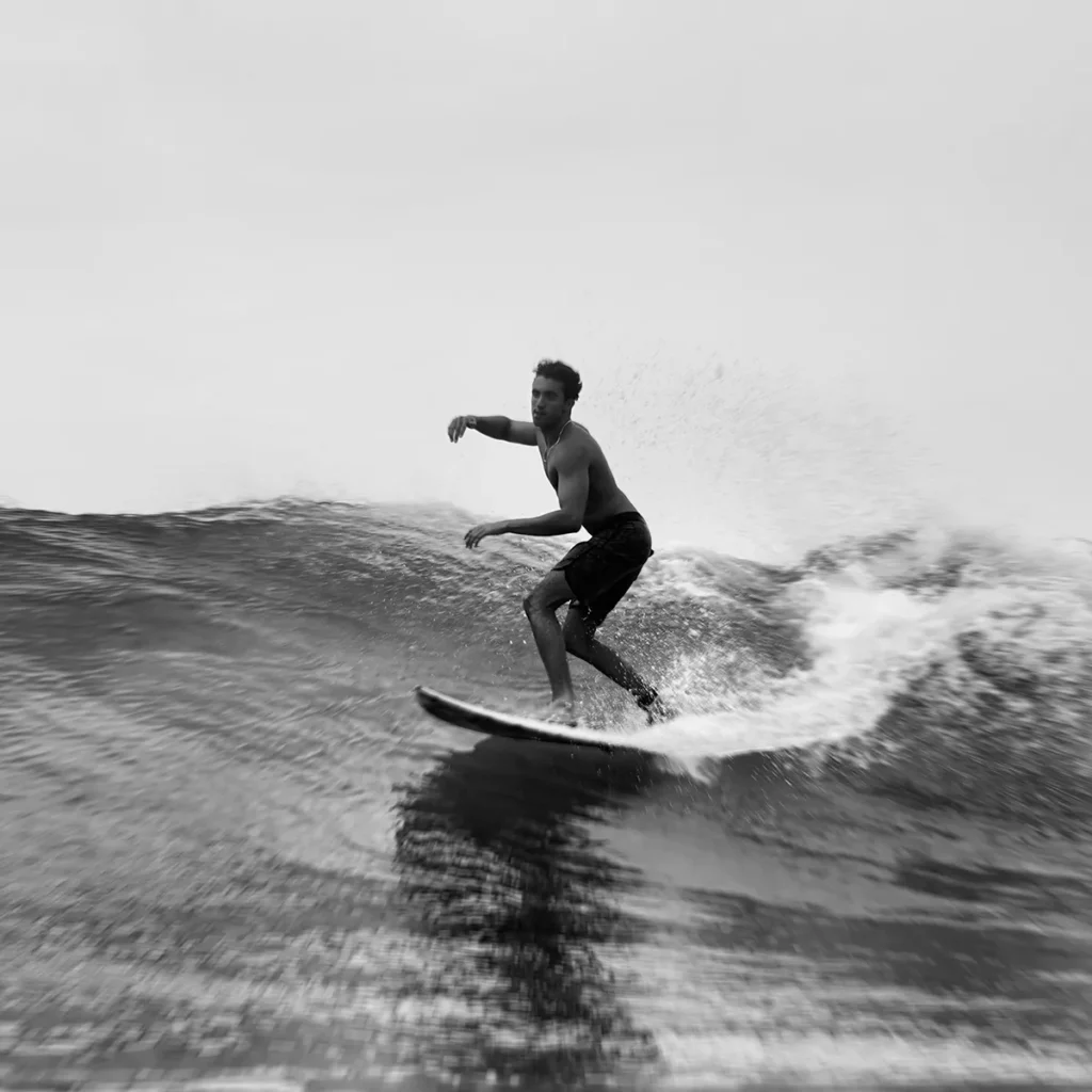 Surfer riding a wave in Taghazout during an all-inclusive surf trip with Taghazout Surf Villa